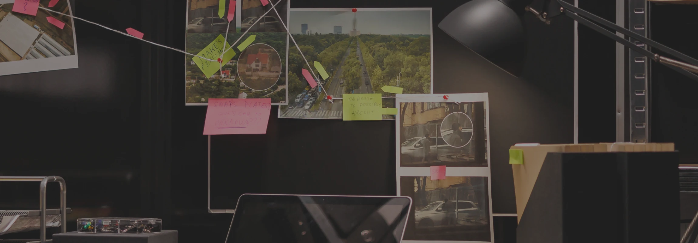 Private Detective Agency Singapore | Detective investigation board featuring surveillance photos, sticky notes, and connecting strings above a cluttered desk workspace.